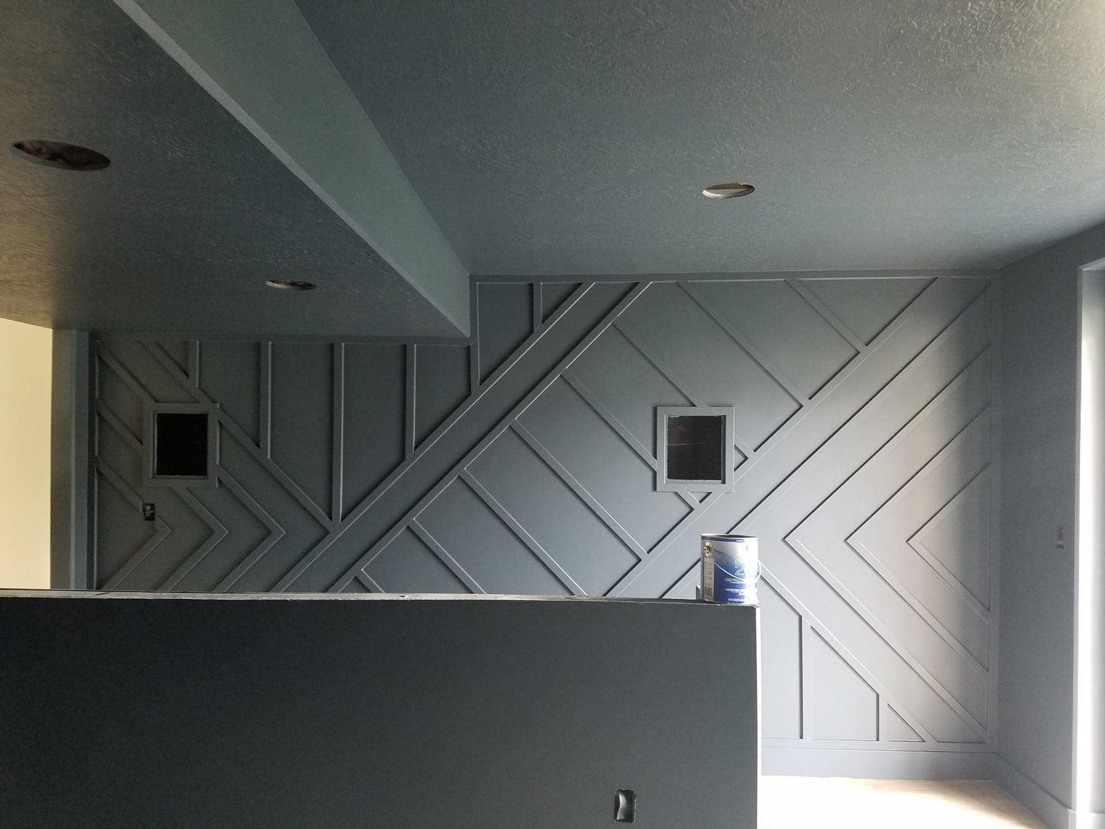 Dark geometric wainscoting in a Utah home theater
