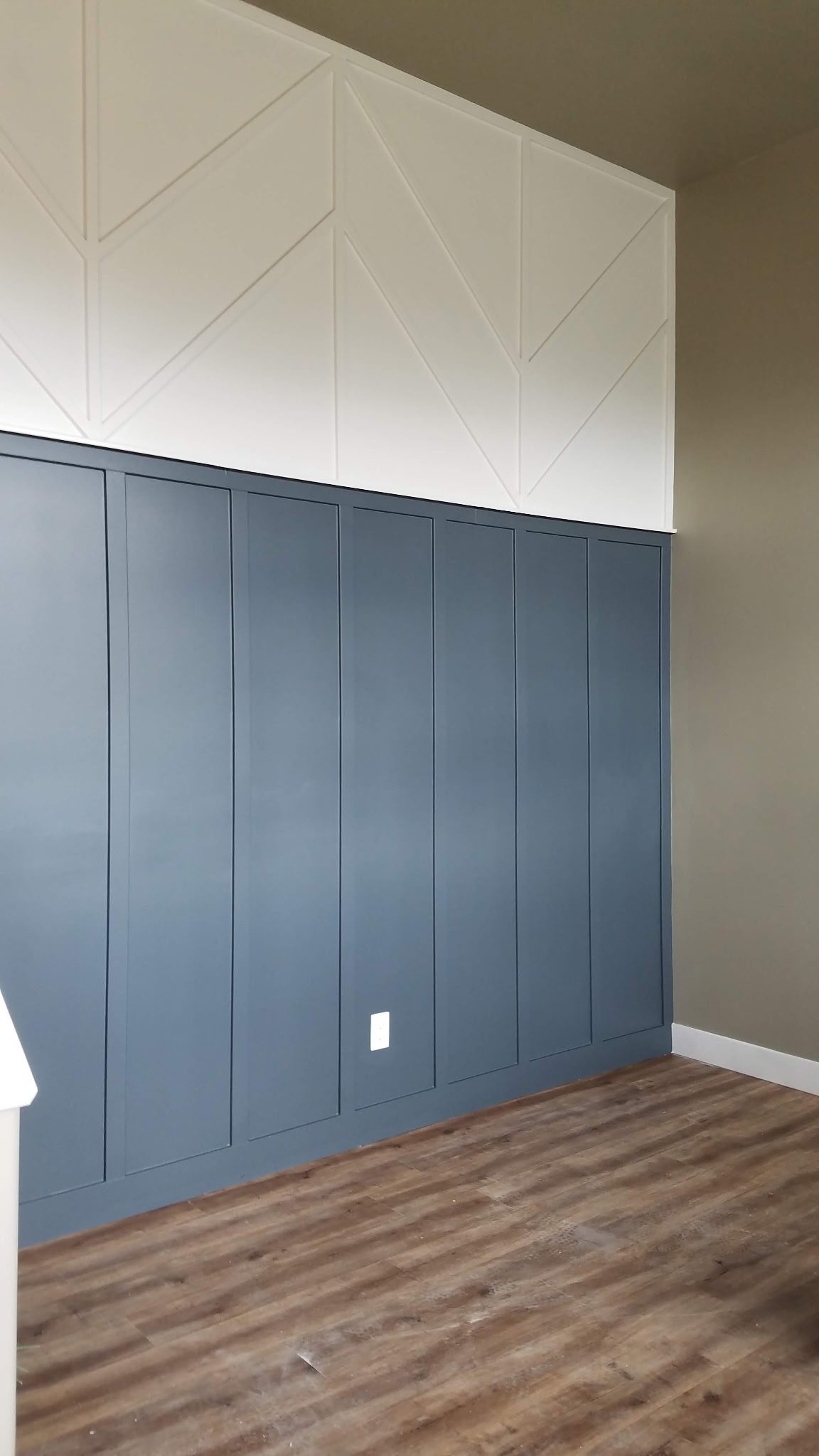 Navy-blue wainscoting accent wall in a Utah home
