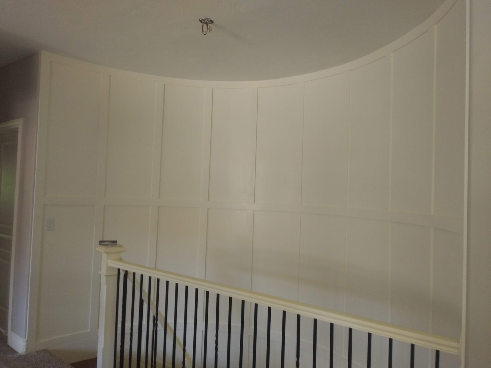 Two-tone wainscoting bedroom accent wall in a Utah home