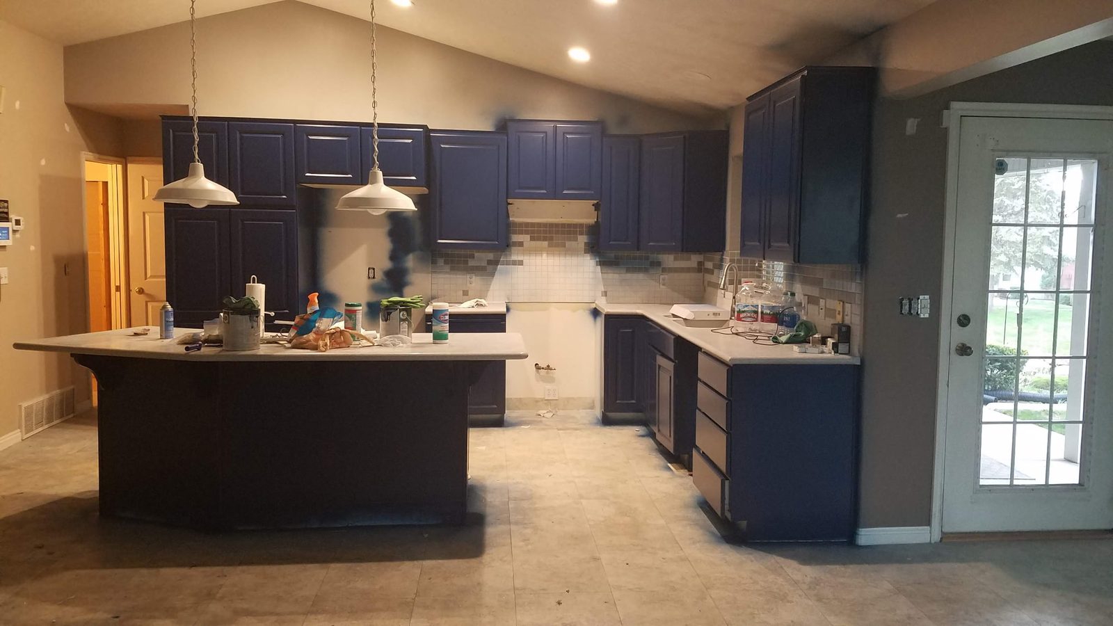 Navy-blue refinished kitchen cabinets in a Utah home