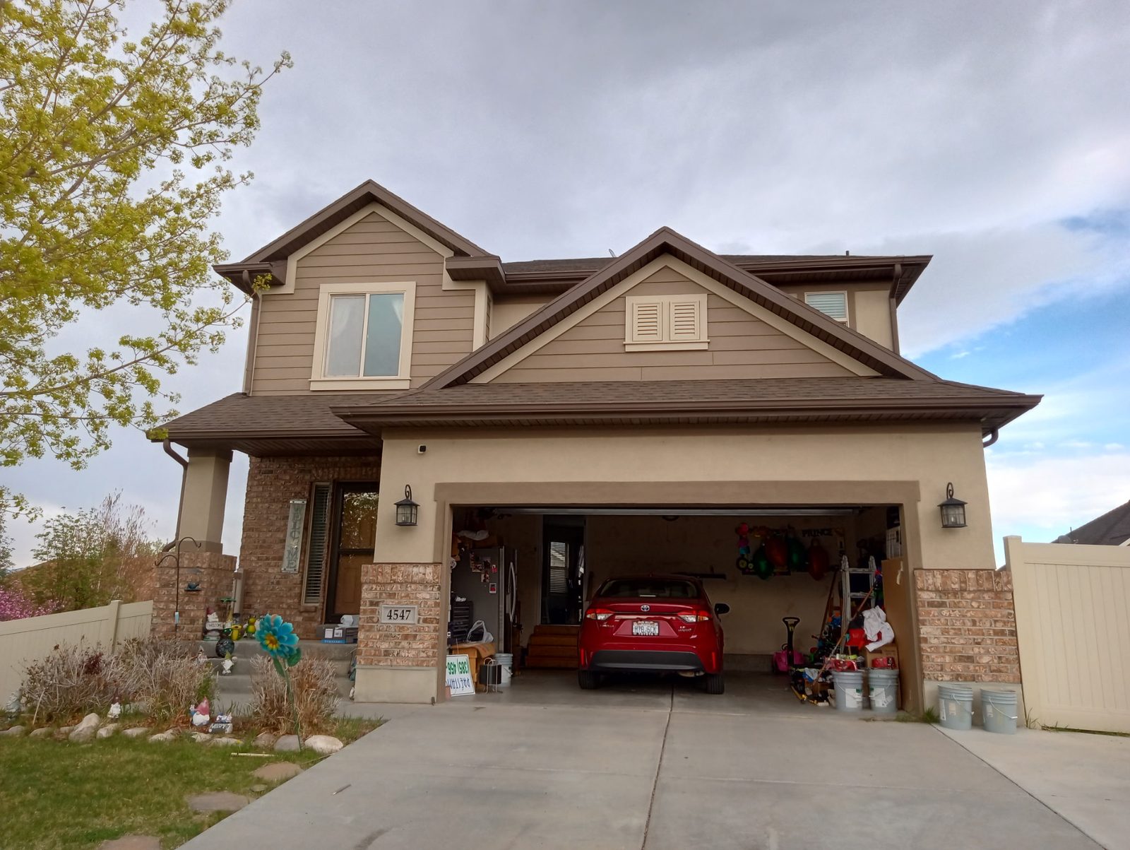Utah two-story home with freshly painted exterior in autumn