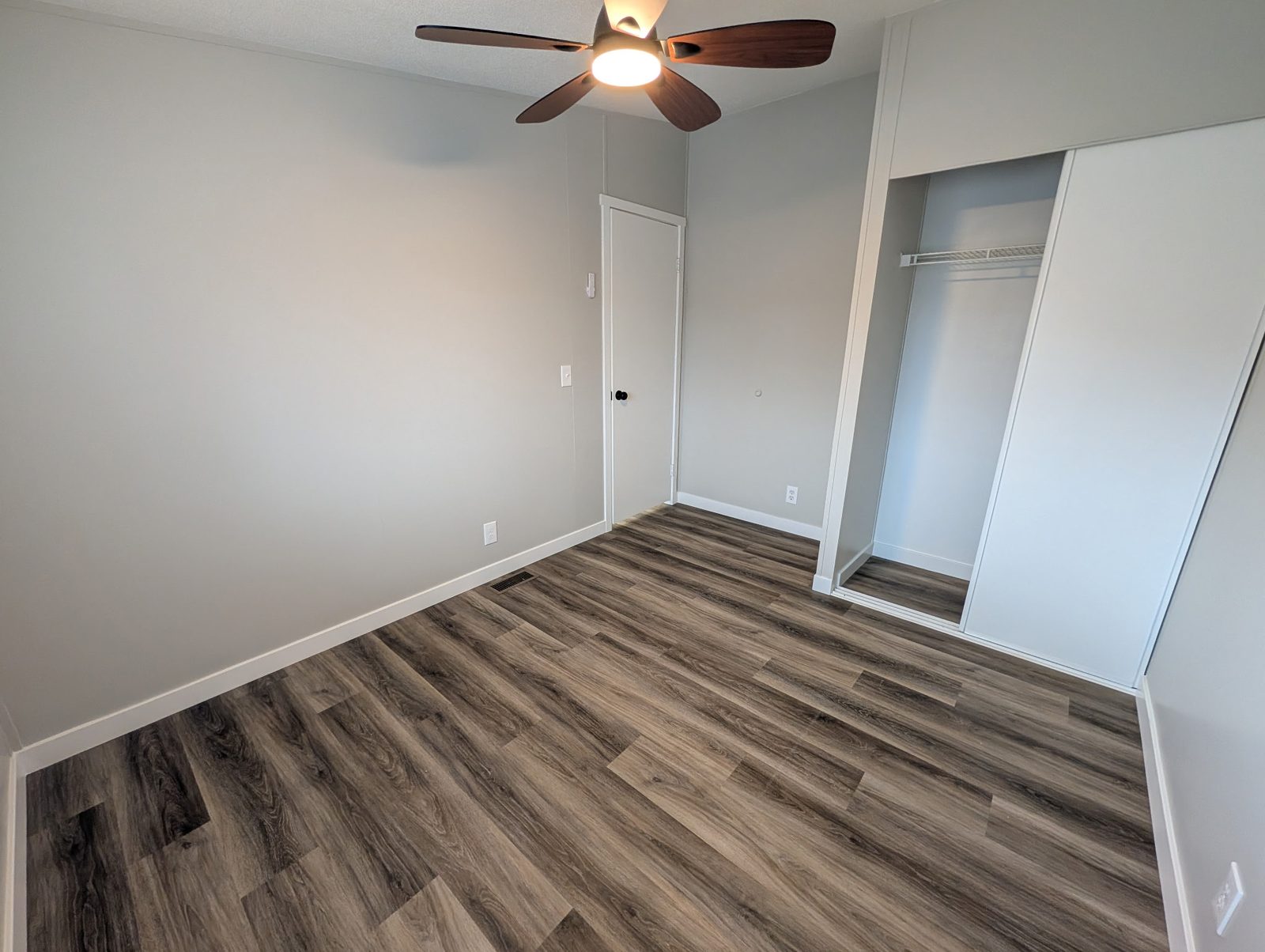 Bedroom repaint with ceiling fan in a Wasatch Front home