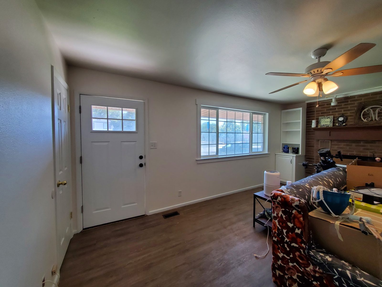 Entryway and painted brick fireplace in a Utah home