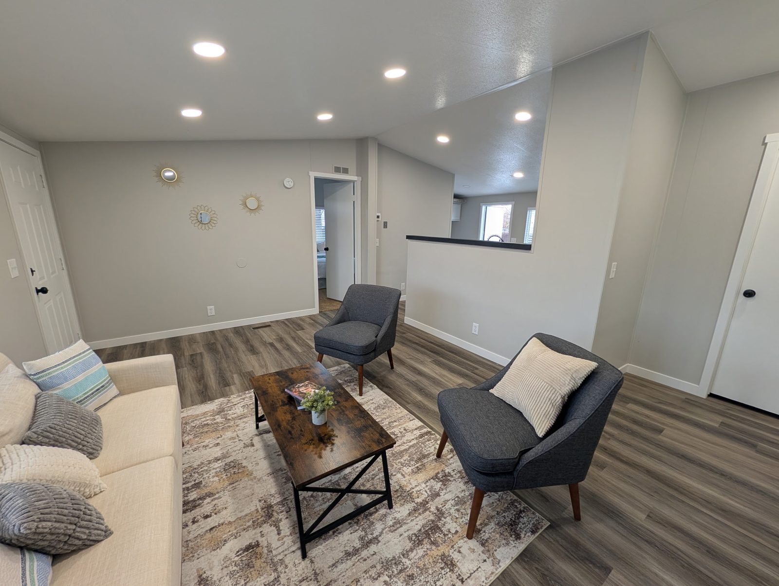Neutral-painted living room with natural light in a Utah home