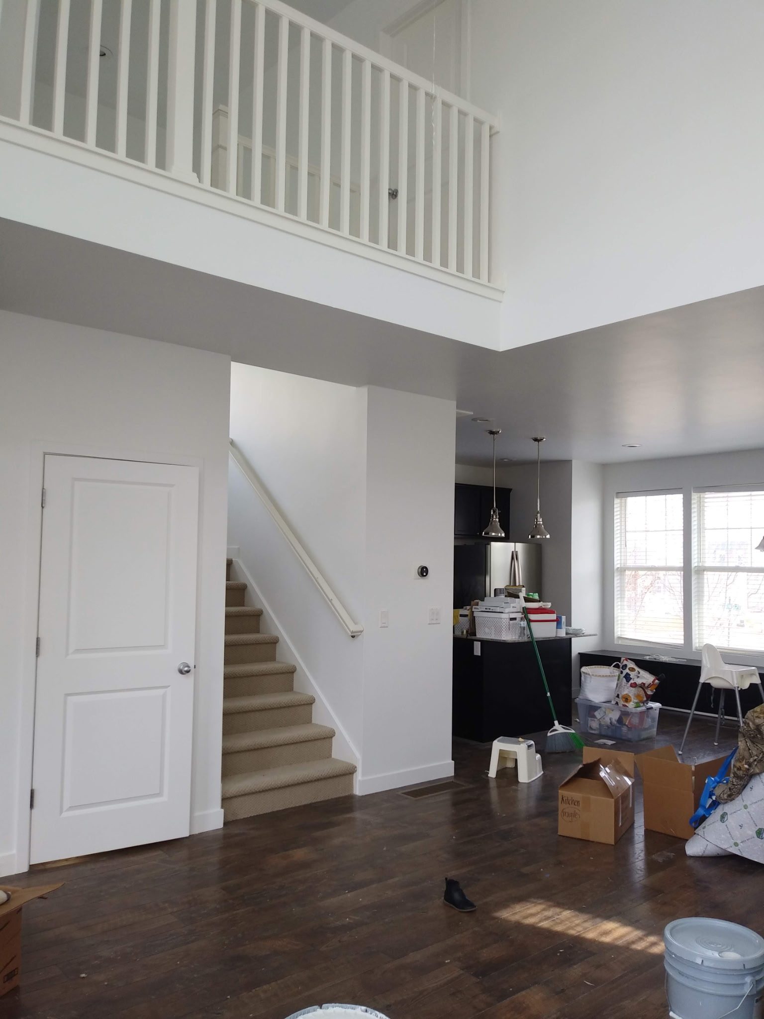 Open staircase and entryway after interior repaint in Utah